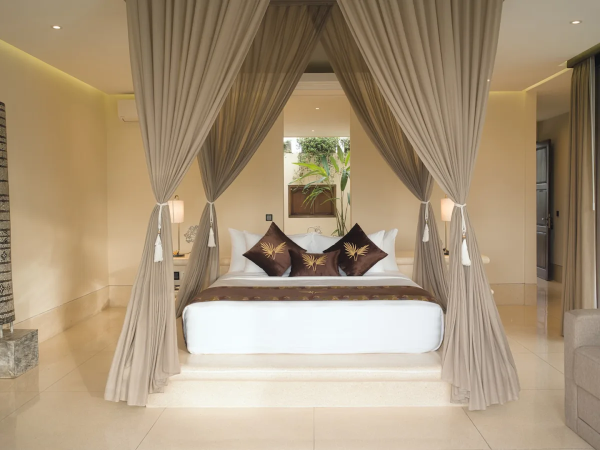Jungle View Royal Suite canopy bedroom with elegant interiors in Ubud, Bali