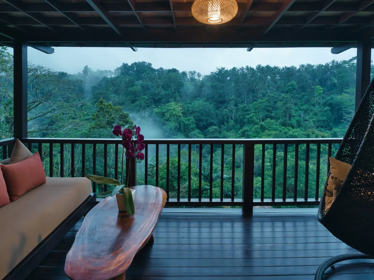 Private balcony of the Panoramic Jungle View Villa overlooking the lush rainforest in Ubud, Bali