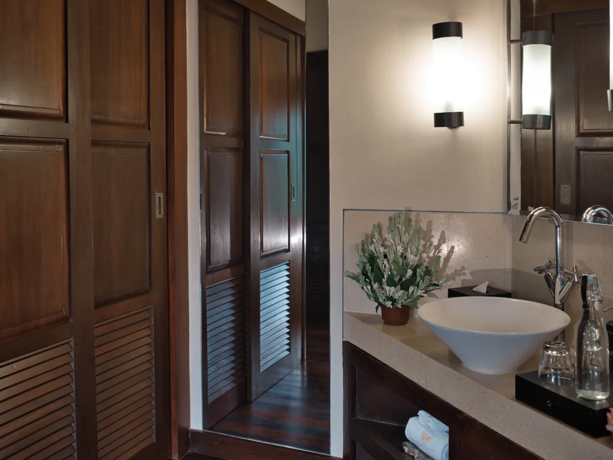 Bathroom vanity and wooden wardrobe inside the Panoramic Jungle View Villa in Ubud, Bali