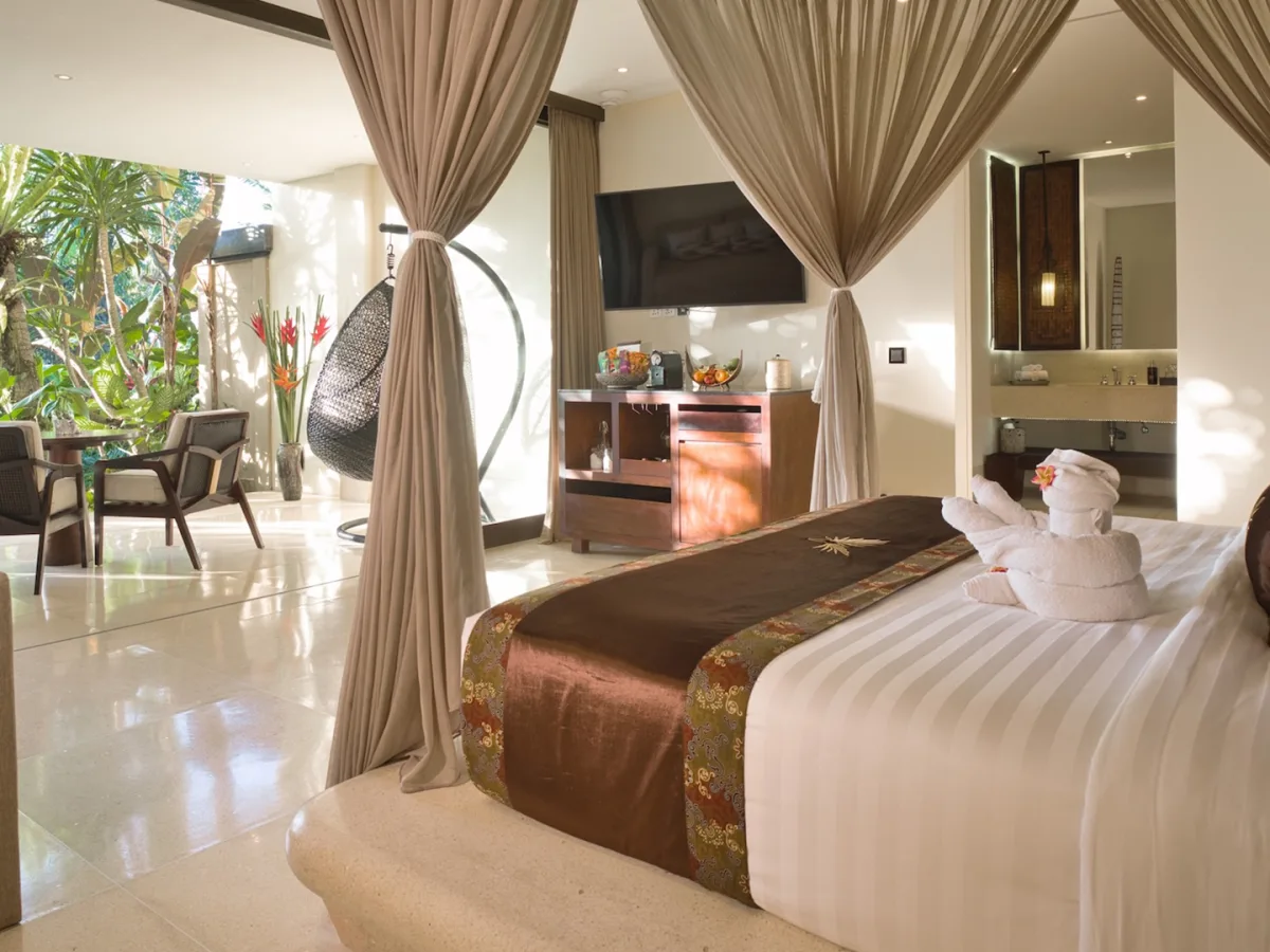 Private Garden Royal Suite bedroom with garden terrace, lounge area, and elegant bathroom in Ubud, Bali