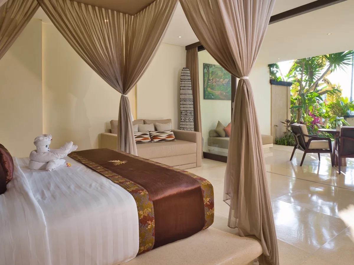 Private Garden Royal Suite bedroom with living area and tropical garden terrace in Ubud, Bali