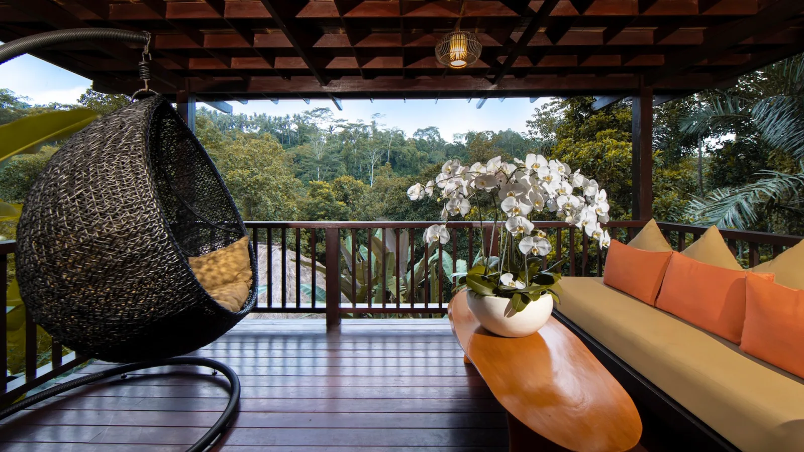 Private balcony of the Jungle View Villa with lush rainforest views in Ubud, Bali